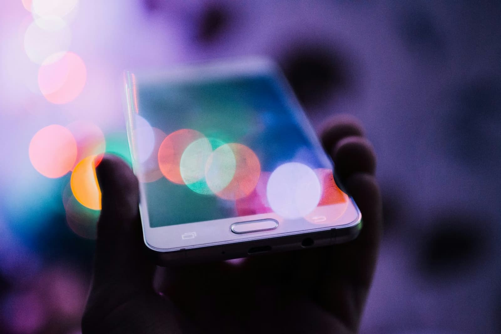 The glow of a phone screen held in the dark