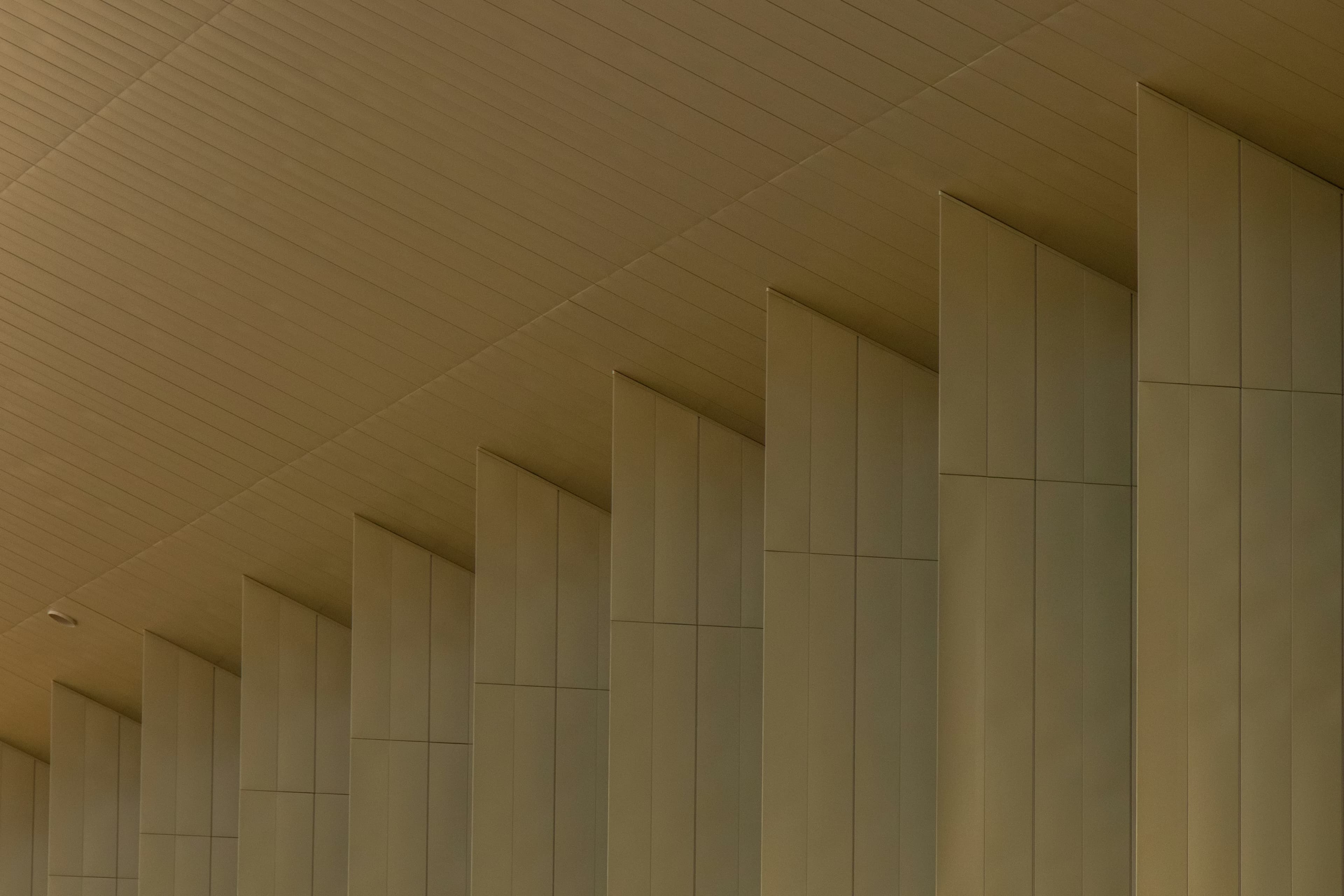 A stone colonnade outside a commercial building.