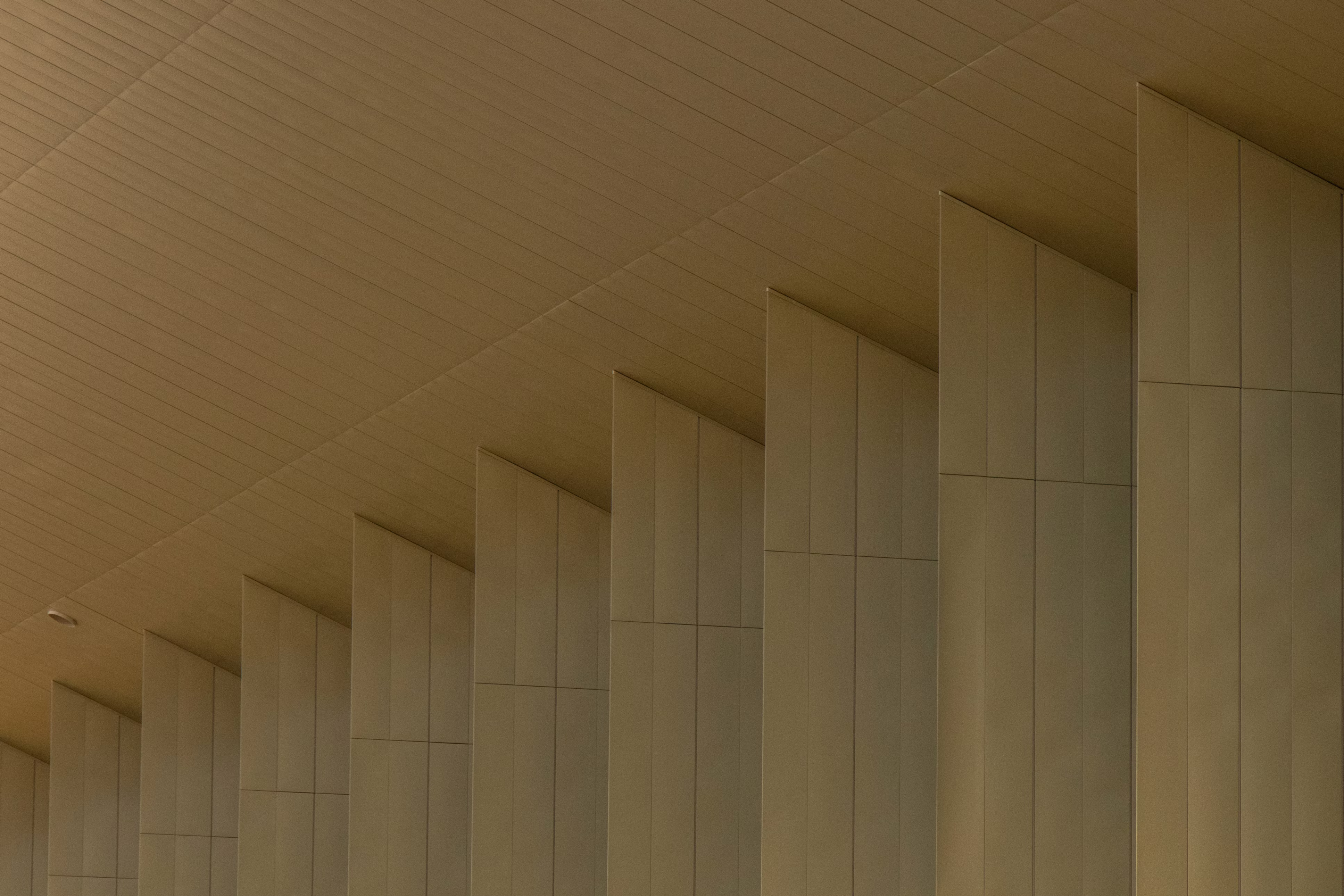 A stone colonnade outside a commercial building.